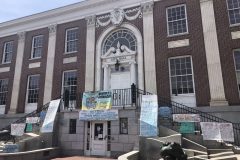 Burlington City Hall with social justice posters